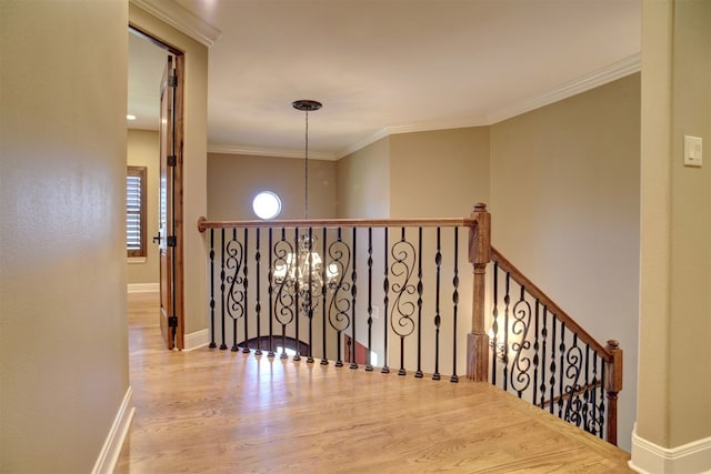 interior space featuring crown molding and light hardwood / wood-style flooring