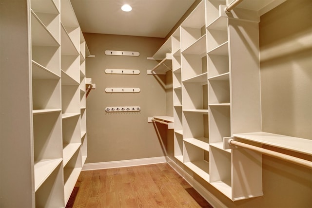 spacious closet featuring light wood-type flooring