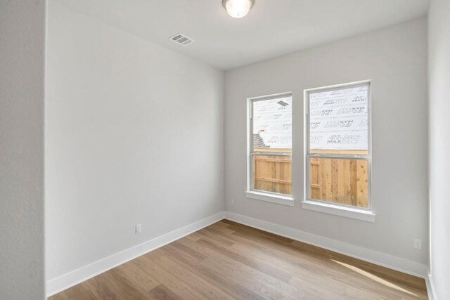 unfurnished room featuring light hardwood / wood-style flooring