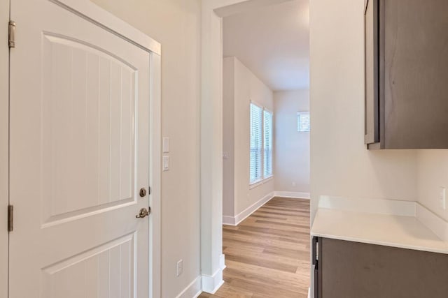 316 Chaste Tree Dr, San Marcos, TX 78666 - hallway featuring baseboards and light wood-type flooring