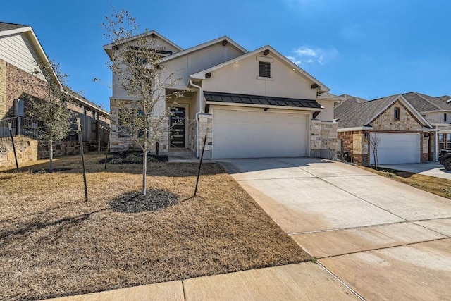 316 Chaste Tree Dr, San Marcos, TX 78666 - view of front of house featuring stone siding, an attached garage, concrete driveway, a standing seam roof, and metal roof