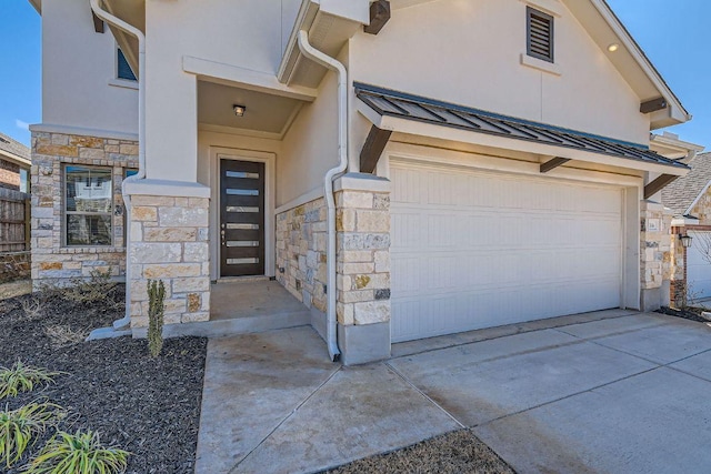 316 Chaste Tree Dr, San Marcos, TX 78666 - view of front of property with stone siding, stucco siding, a standing seam roof, concrete driveway, and metal roof