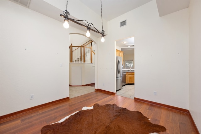 unfurnished dining area with light hardwood / wood-style flooring