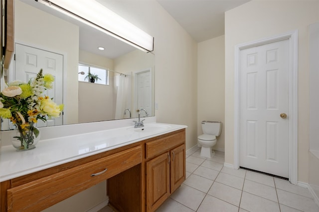 bathroom featuring tile patterned flooring, vanity, curtained shower, and toilet