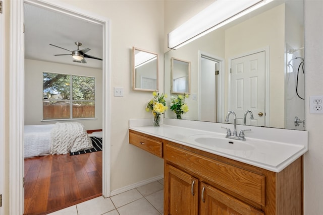 bathroom featuring tile patterned floors, ceiling fan, and vanity