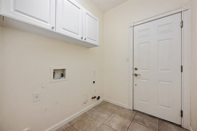 washroom with hookup for an electric dryer, hookup for a washing machine, cabinets, gas dryer hookup, and light tile patterned floors