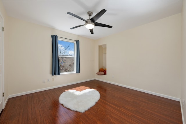 unfurnished room featuring dark hardwood / wood-style floors and ceiling fan