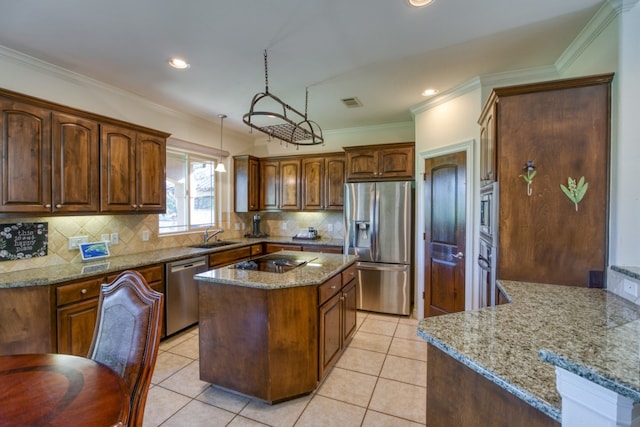 kitchen with tasteful backsplash, stone counters, a center island, and stainless steel appliances