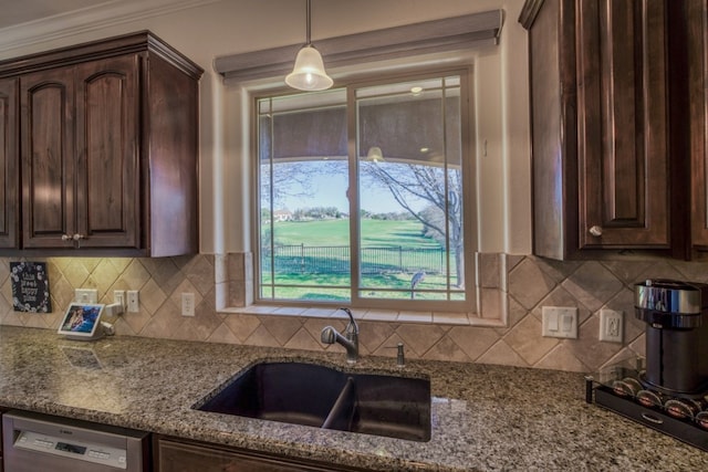 kitchen with dishwasher, light stone countertops, dark brown cabinetry, and sink