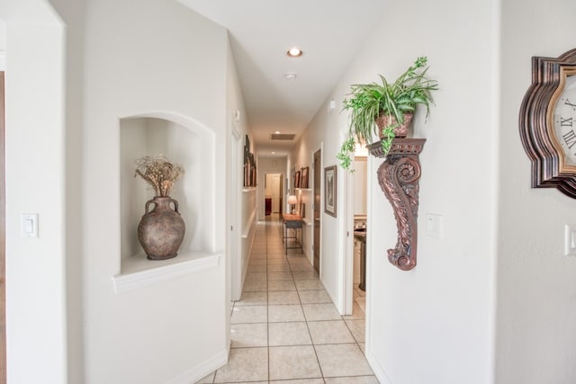 corridor featuring light tile patterned flooring