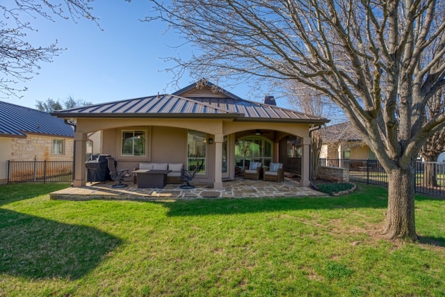 rear view of house with a patio area, an outdoor hangout area, and a yard