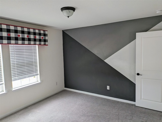 additional living space featuring dark colored carpet