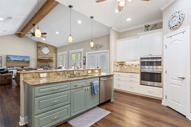 kitchen with dark hardwood / wood-style floors, ceiling fan, a center island with sink, stainless steel appliances, and white cabinetry