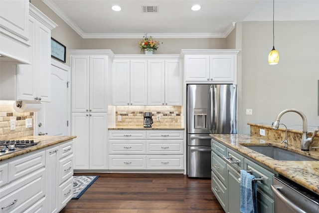 kitchen featuring white cabinets, dark hardwood / wood-style floors, and pendant lighting