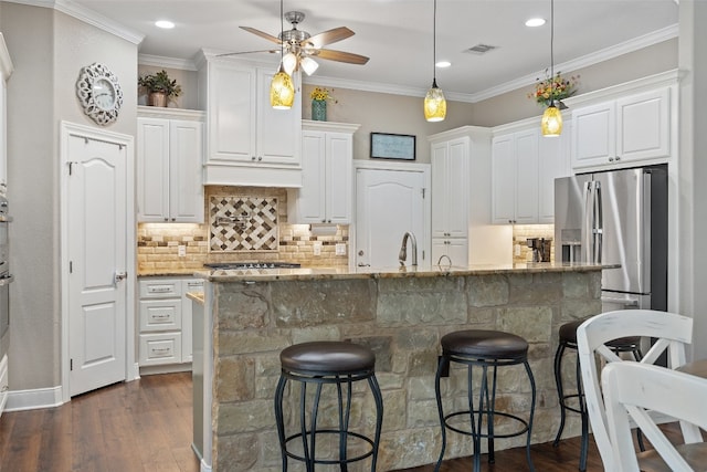 kitchen with decorative light fixtures, white cabinetry, and dark wood-type flooring