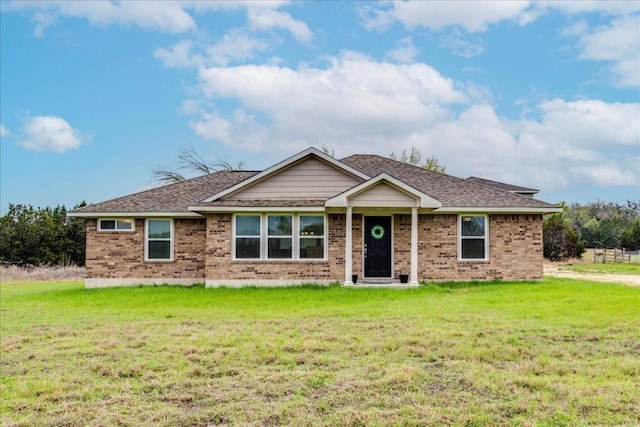 2525 Fm 32, San Marcos, TX 78666 - ranch-style house with brick siding, a front lawn, and a shingled roof