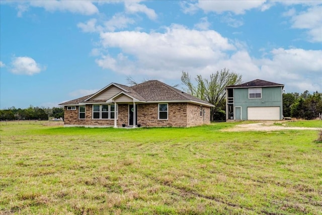 view of front facade featuring a garage and a front lawn