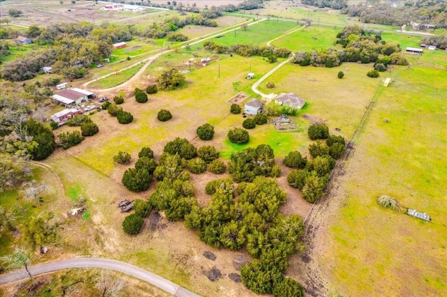 birds eye view of property with a rural view