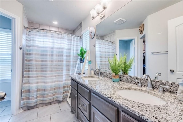 bathroom featuring tile patterned flooring, vanity, and a shower with shower curtain