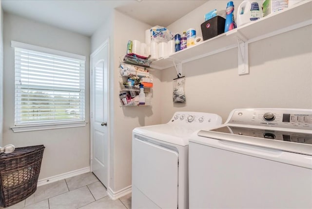 washroom featuring independent washer and dryer and light tile patterned floors