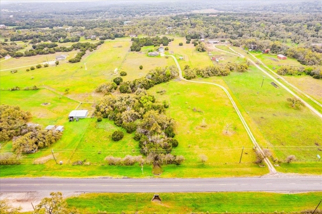 birds eye view of property with a rural view