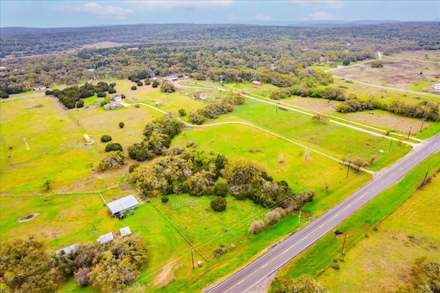 birds eye view of property featuring a rural view