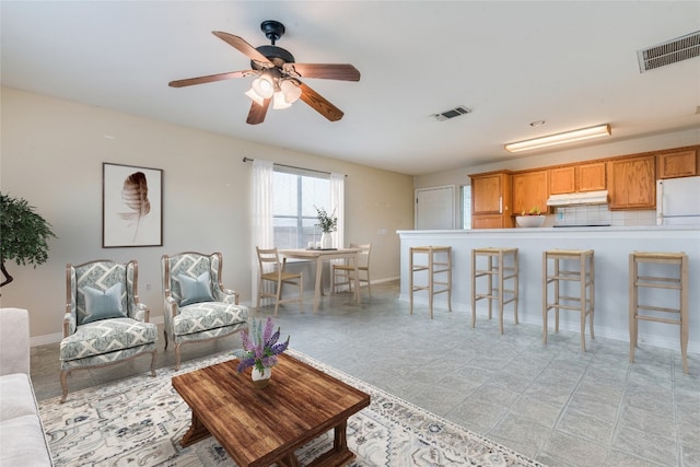 living room with ceiling fan