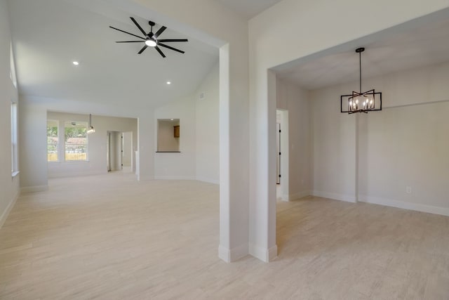 117 Callie St, Smithville, TX 78957 - empty room with a chandelier, light wood-style flooring, baseboards, a ceiling fan, and high vaulted ceiling