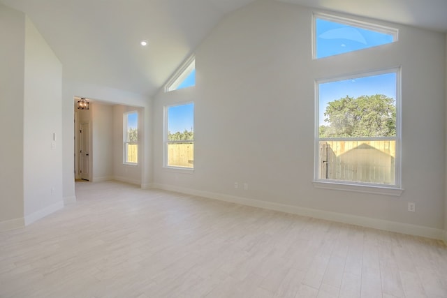 117 Callie St, Smithville, TX 78957 - empty room with high vaulted ceiling, light wood-style flooring, baseboards, and recessed lighting