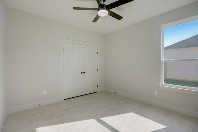 117 Callie St, Smithville, TX 78957 - unfurnished bedroom with wood finished floors, baseboards, and a closet