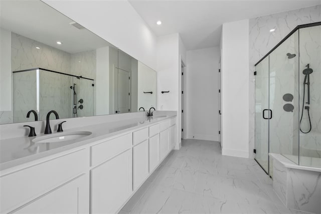 bathroom featuring walk in shower and vanity