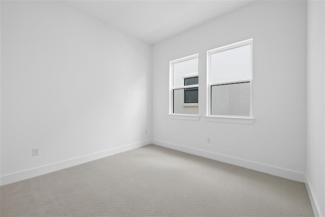 spare room featuring carpet floors