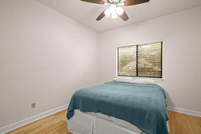 bedroom featuring wood-type flooring and ceiling fan