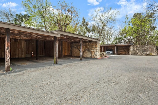 view of parking featuring a carport