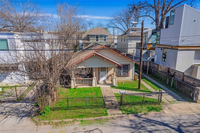 view of front of home with a porch and a front lawn