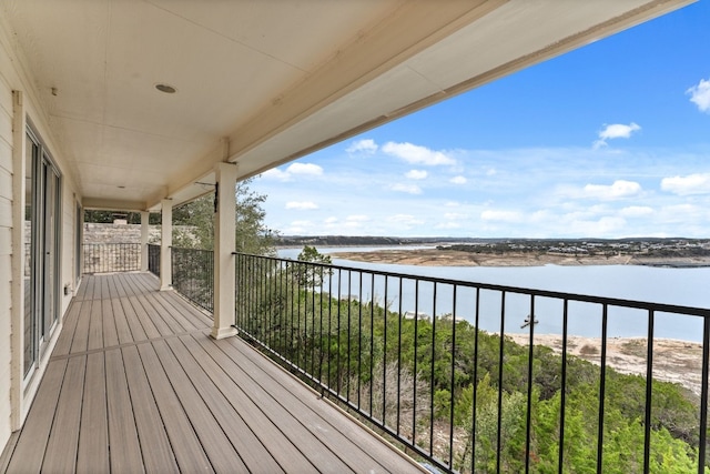 wooden terrace with a water view