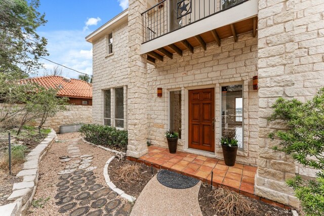 doorway to property featuring a balcony