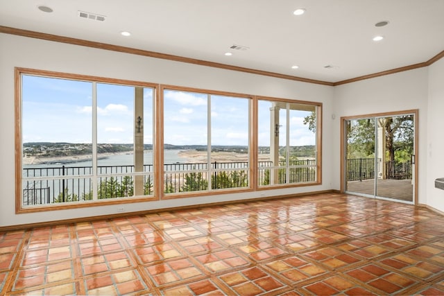 unfurnished sunroom with a water view