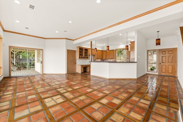 unfurnished living room with ornamental molding