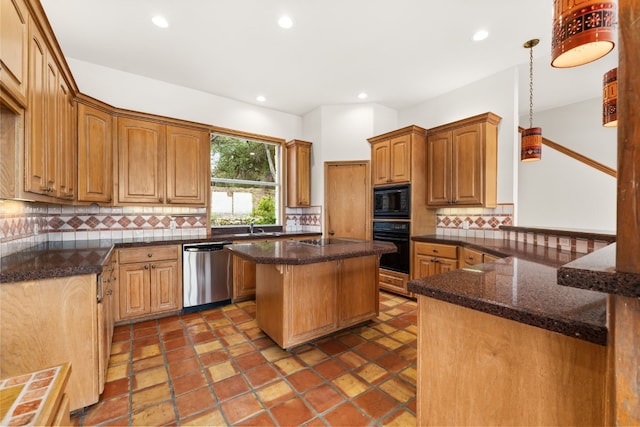 kitchen with a kitchen island, decorative light fixtures, tasteful backsplash, dark stone countertops, and black appliances