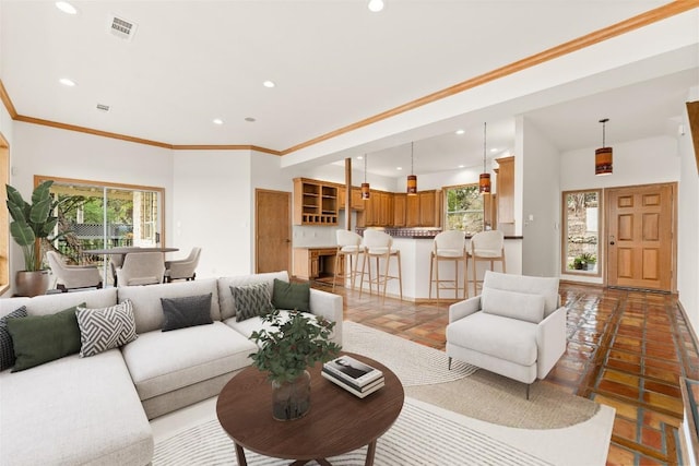 living room with ornamental molding