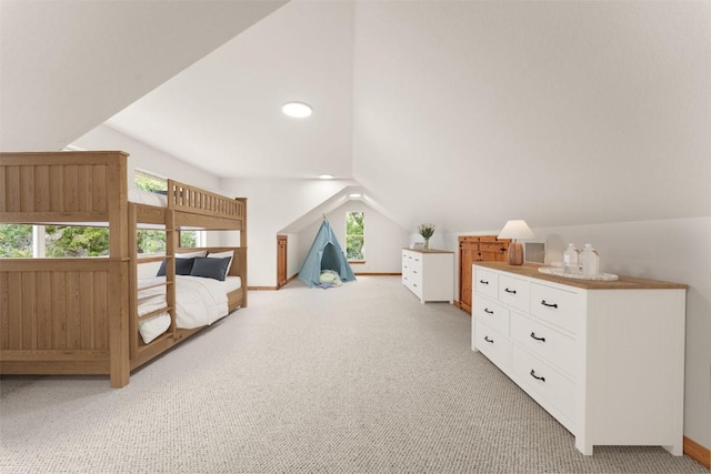 carpeted bedroom featuring vaulted ceiling