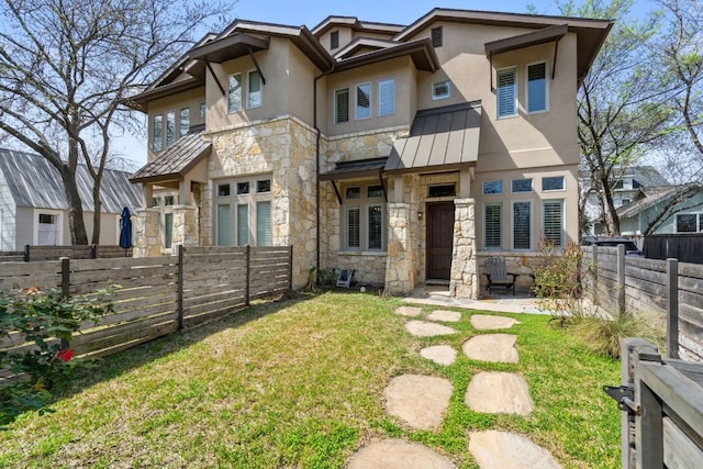 view of front of home with a front yard