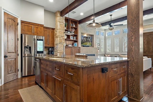 kitchen with a kitchen island with sink, ceiling fan, sink, dark hardwood / wood-style flooring, and beam ceiling