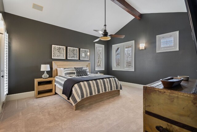 bedroom featuring light carpet, vaulted ceiling with beams, and ceiling fan