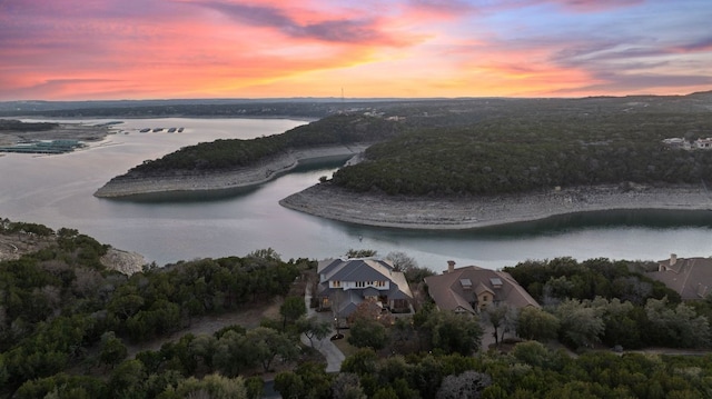 aerial view at dusk with a water view