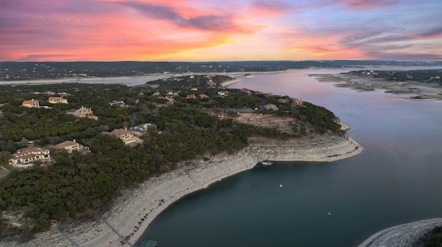 aerial view at dusk with a water view