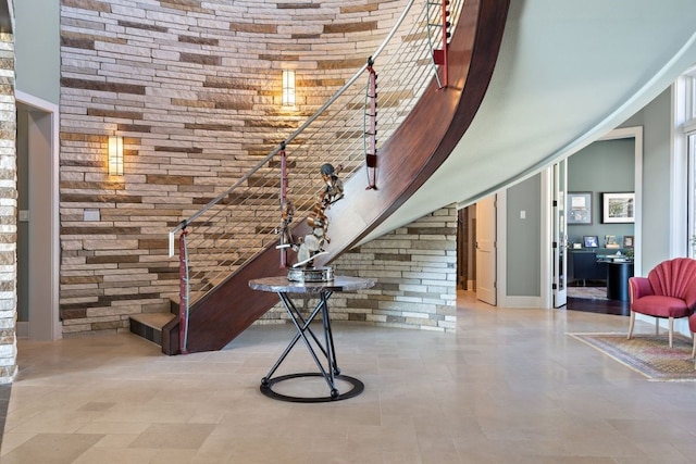 stairway with a towering ceiling