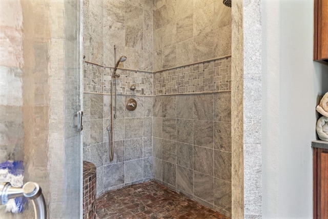 bathroom with a shower with shower door