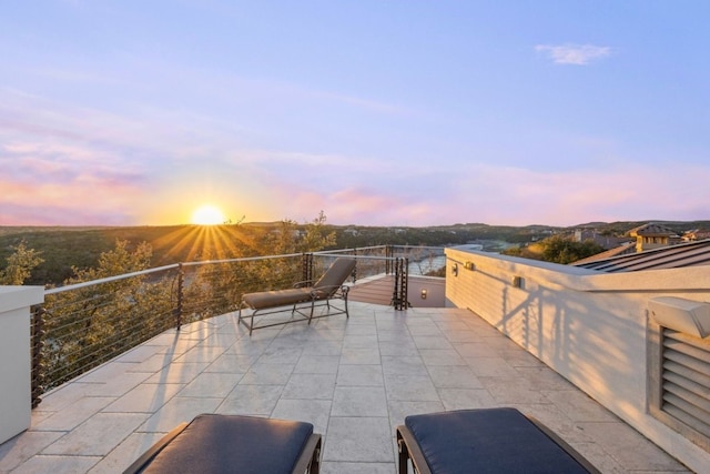 view of patio terrace at dusk